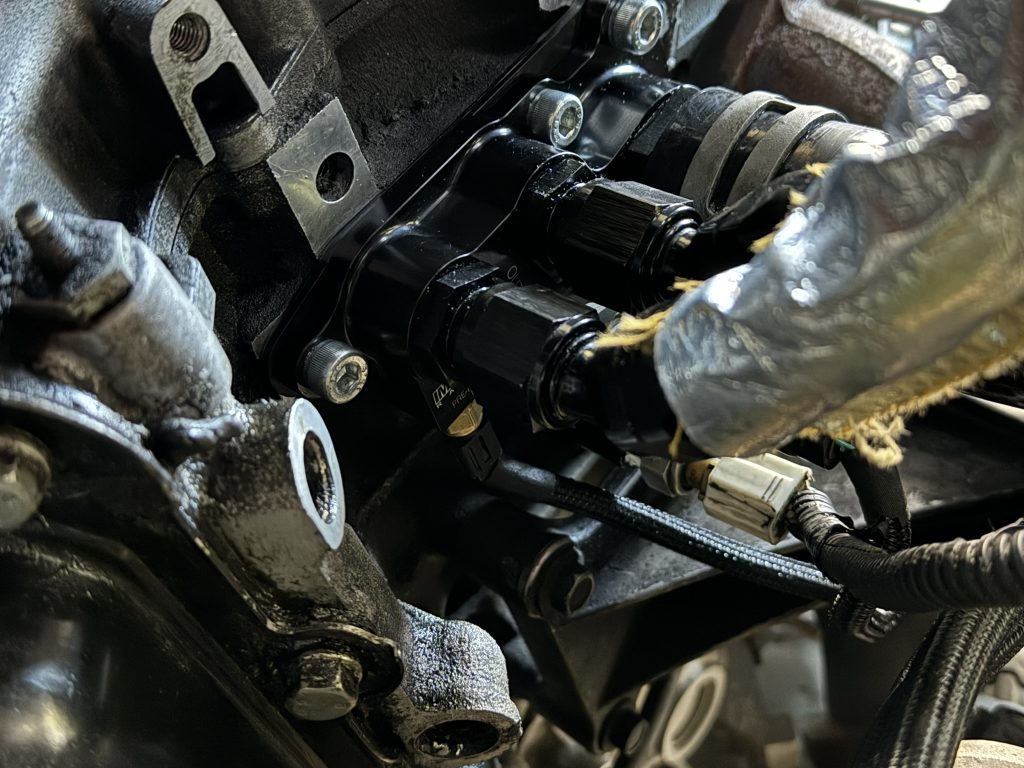 oil cooler plumbing bracket installed