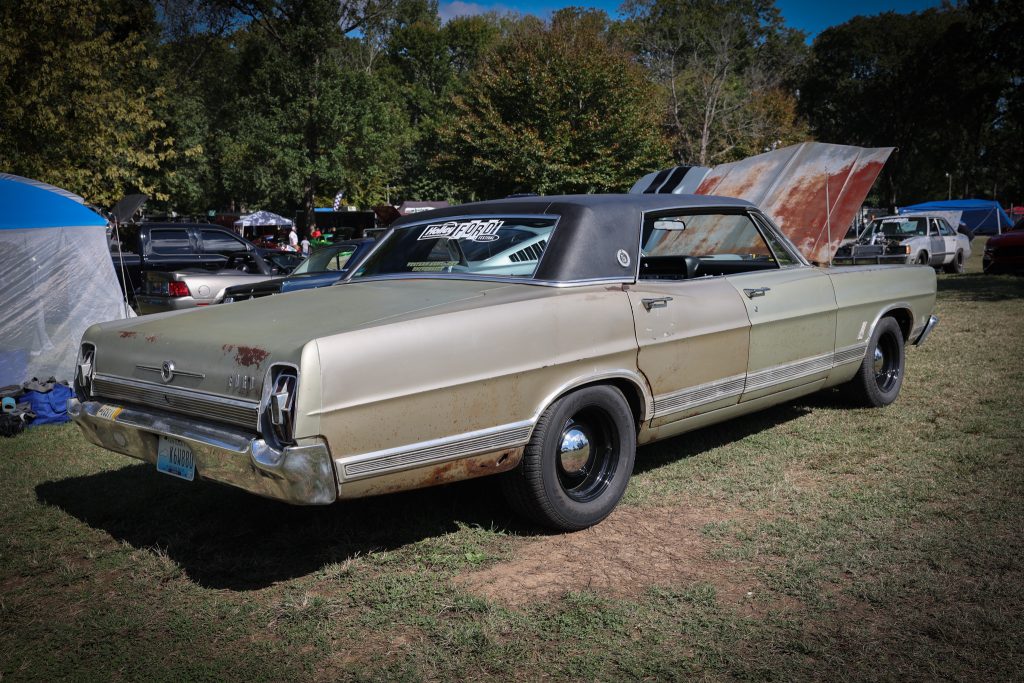 vintage ford sedan at a car show