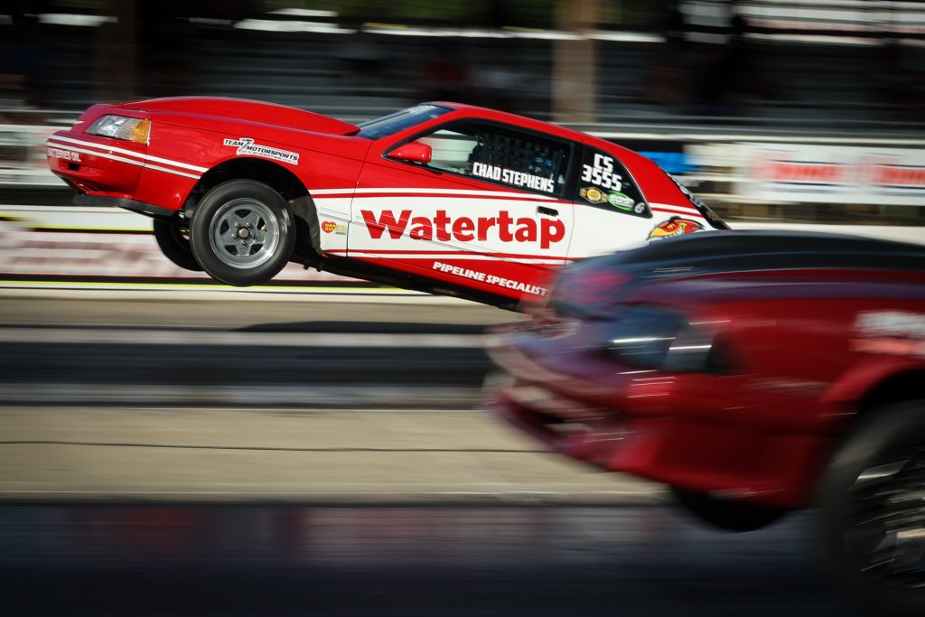 side view of a fox mustang launching at drag race