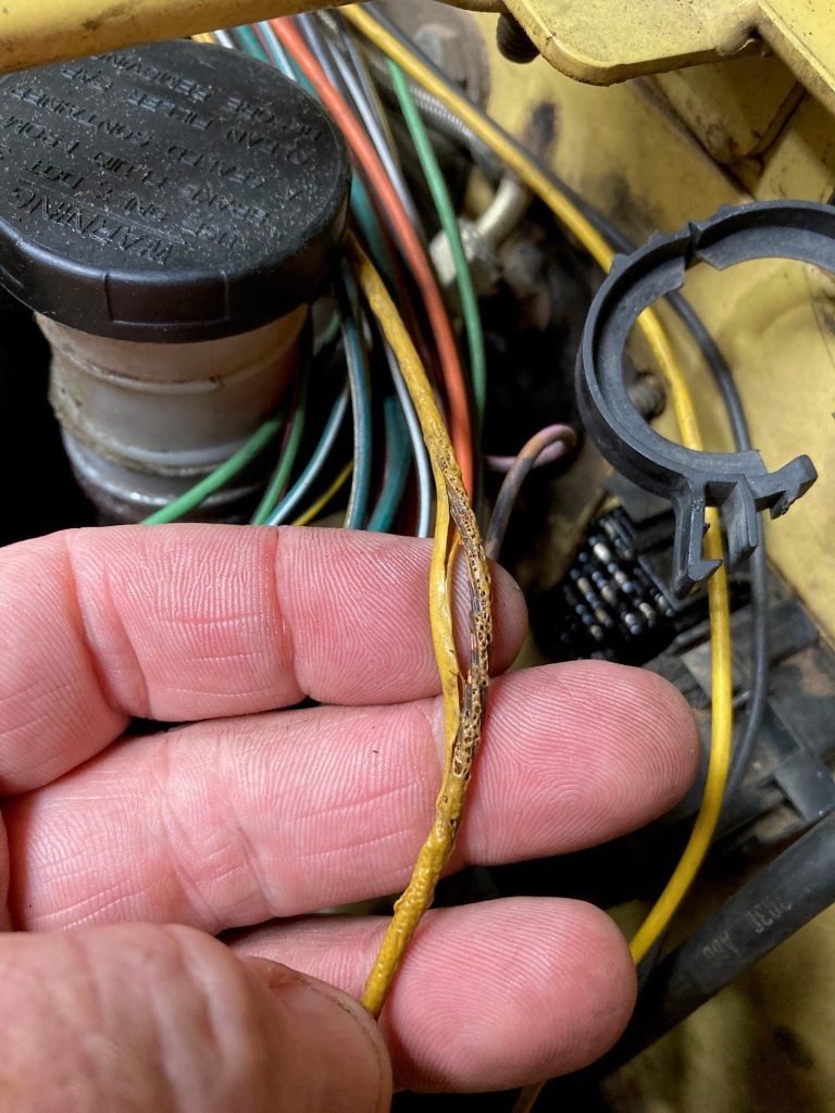 burnt, melted wire in a vehicle wiring harness