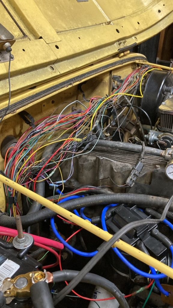 new wiring harness getting installed in a Jeep