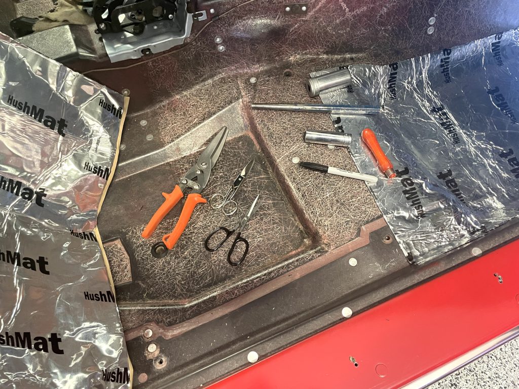 Installing HushMat floor insulation in C3 Corvette