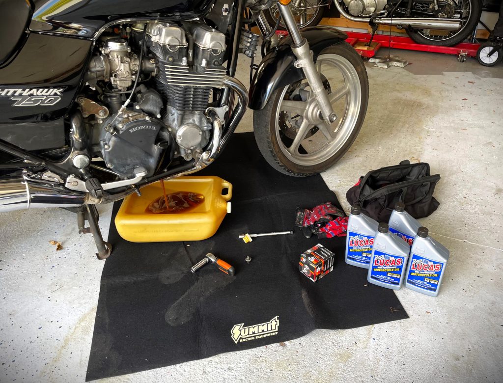 summit racing oil change mat under a motorcycle