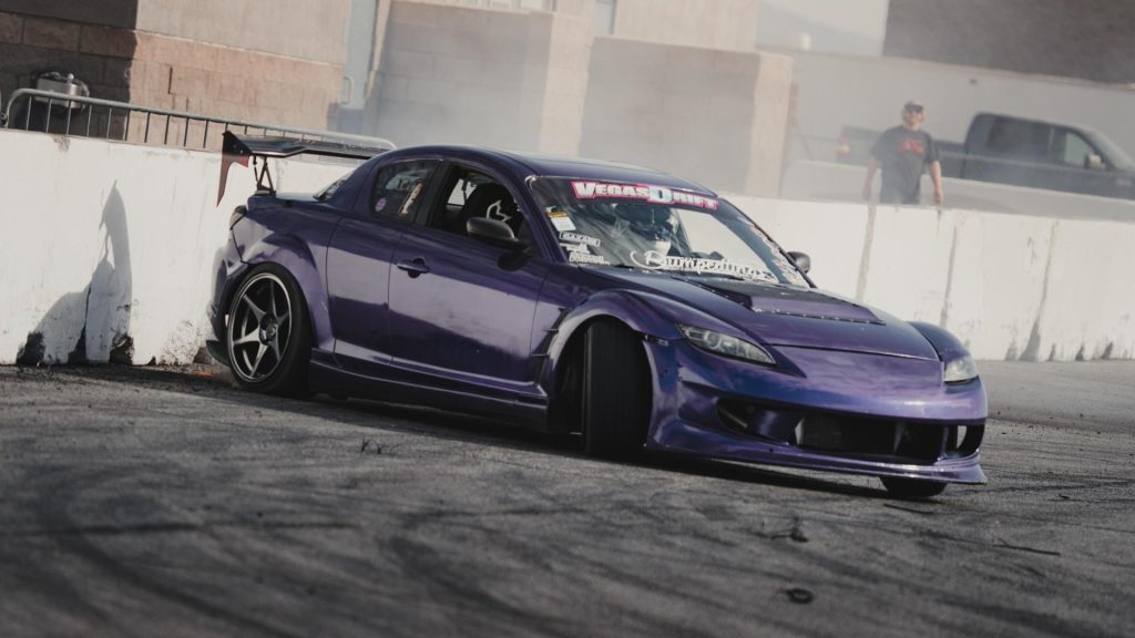 Mazda RX8 drift car near barrier on drift course