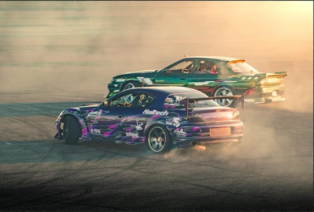 a pair of drift cars in competition