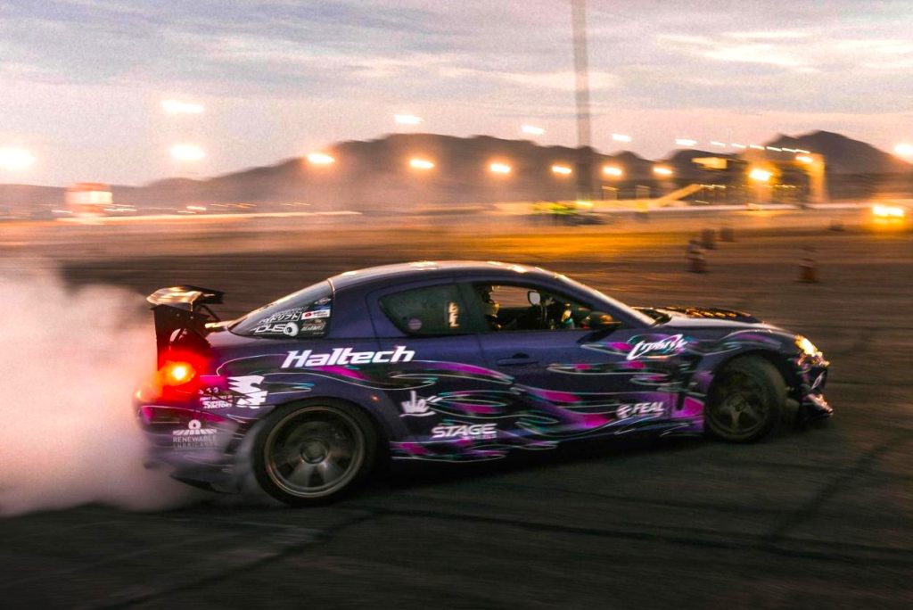 rx8 drift car on track at dusk