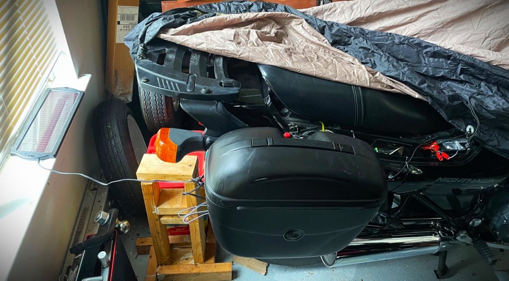 solar charger connected to a motorcycle BATTERY