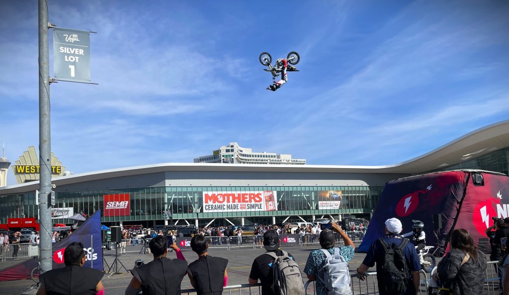 motocross rider doing a jump for a crowd