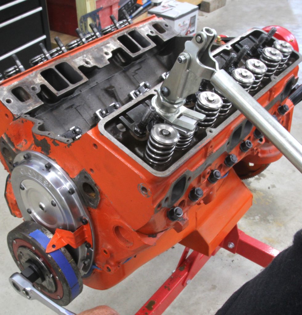 Using valve spring compressor as piston stop