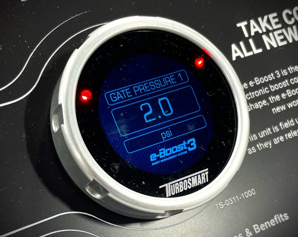 close up of a turbosmart Eboost 3 controller gauge