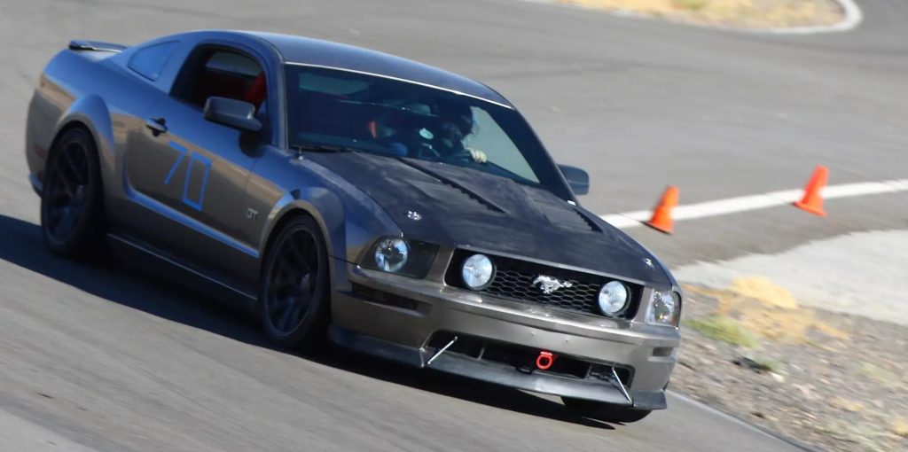 chris campbell in a ford mustang track car