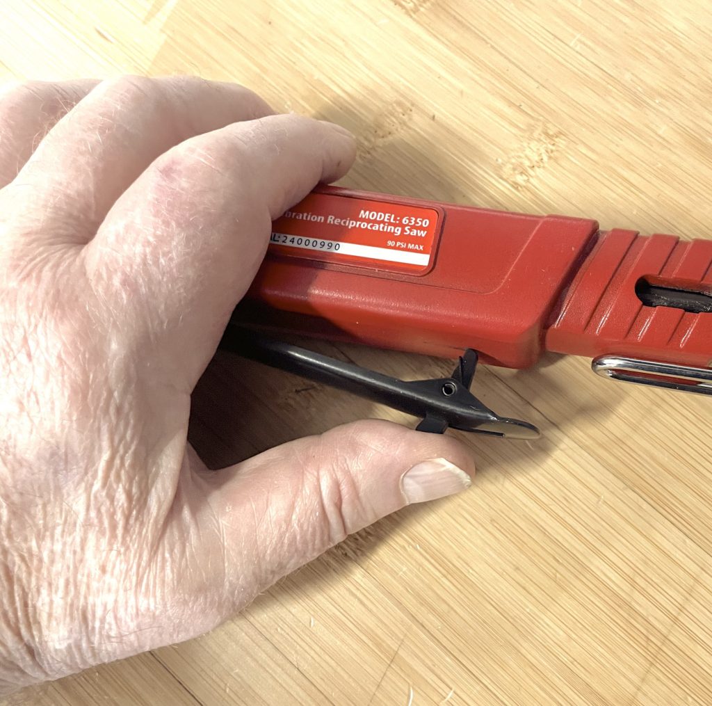 Dual action trigger on AIRCAT air saw