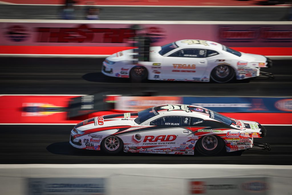 2 pro stock drag cars on track