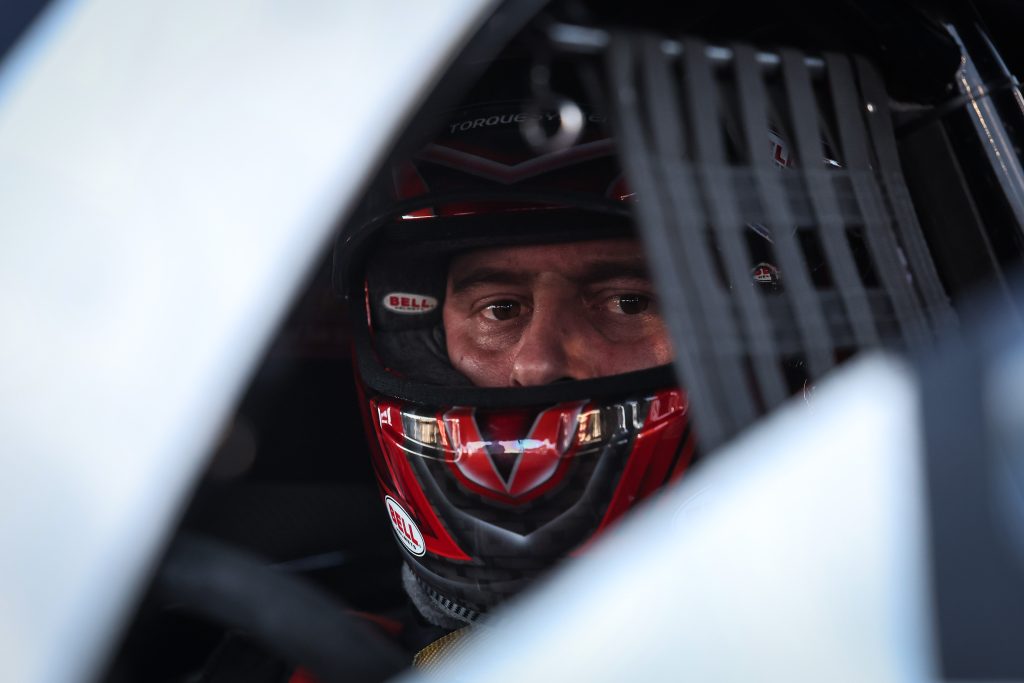 Dallas Glenn in helmet in Pro Stock racer cockpit