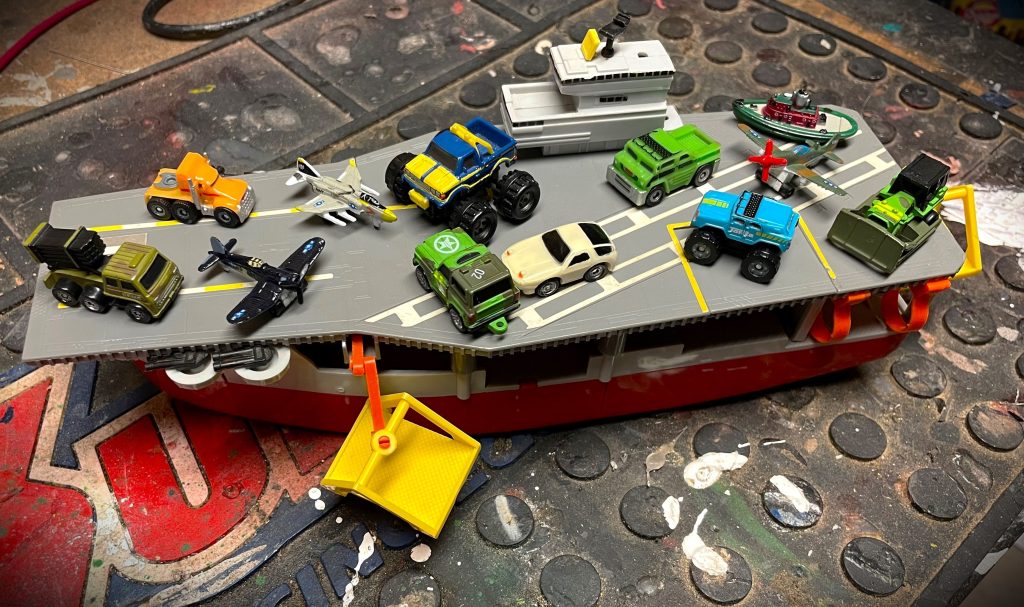 micro machines toys on an aircraft carrier