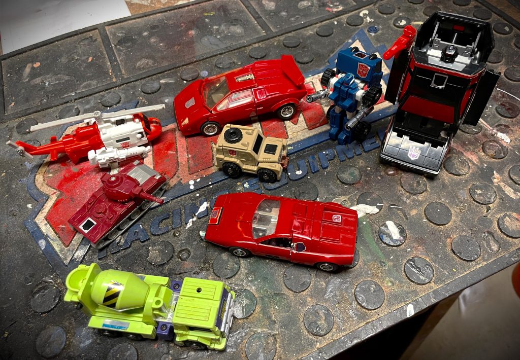 transformer toy robots on a workbench