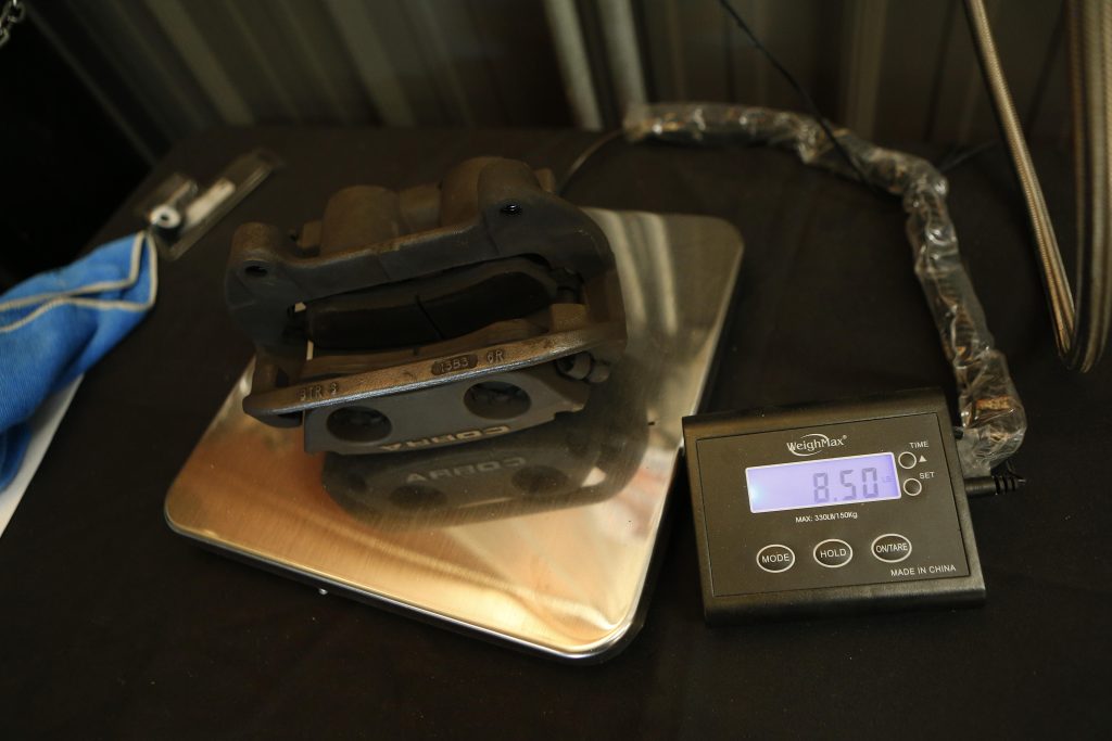 weighing a brake caliper on a scale