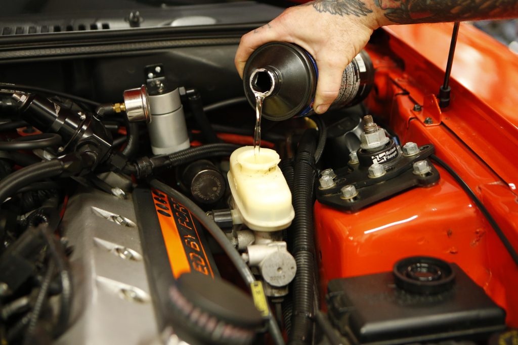 filling a master cylinder reservoir with brake fluid