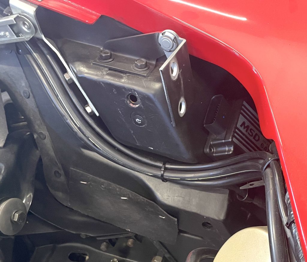 MSD Ultra 6 AL ignition box mounted on C3 Corvette fiberglass panel