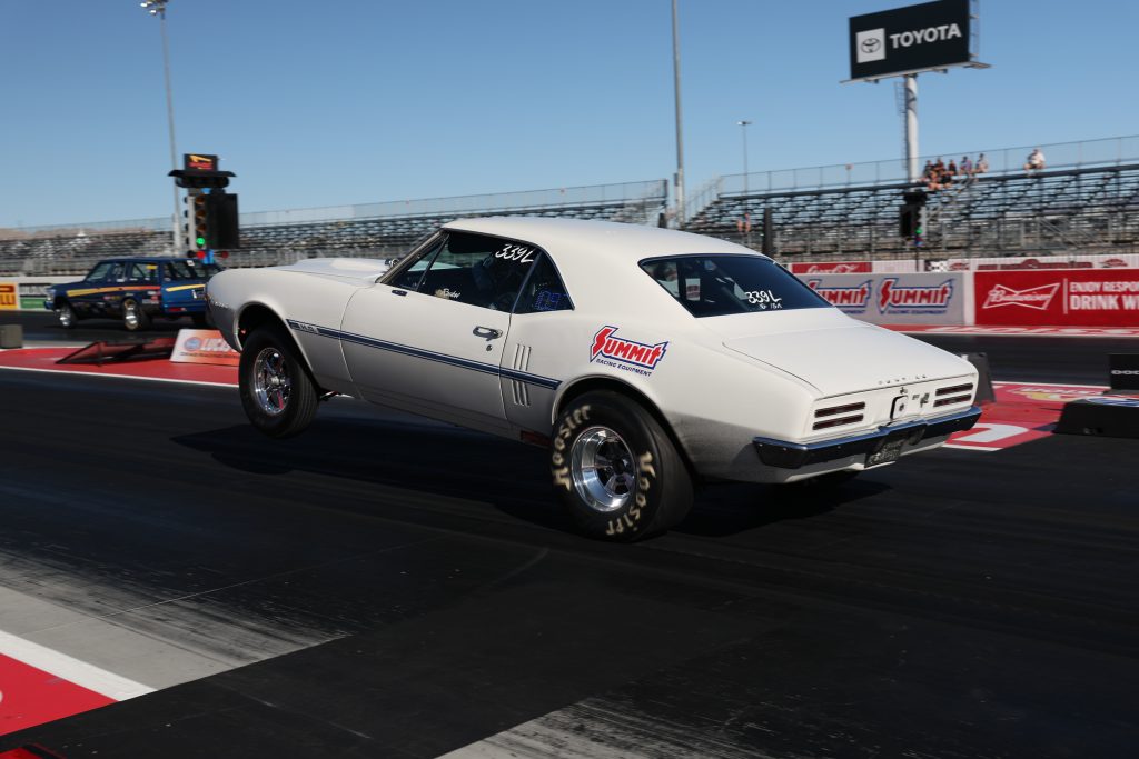 1967 pontiac firebird drag car launching on track