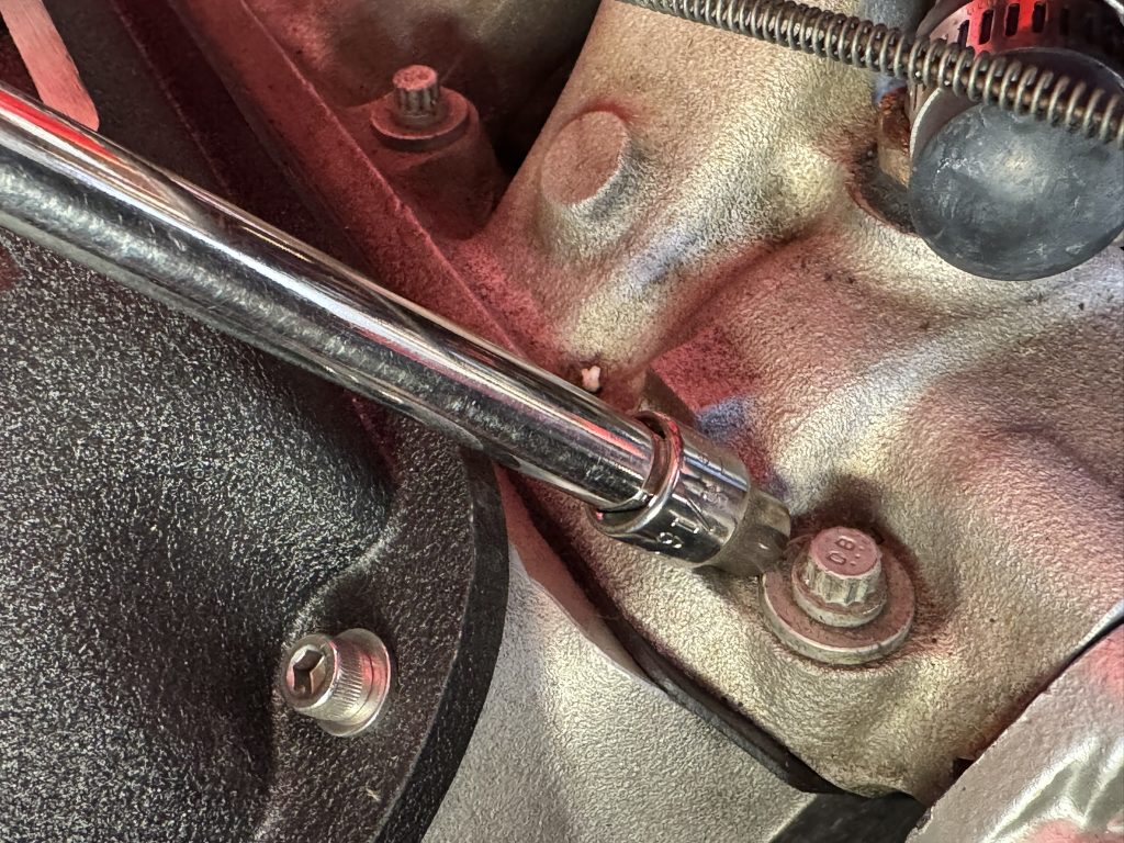 installing bolts into an intake manifold