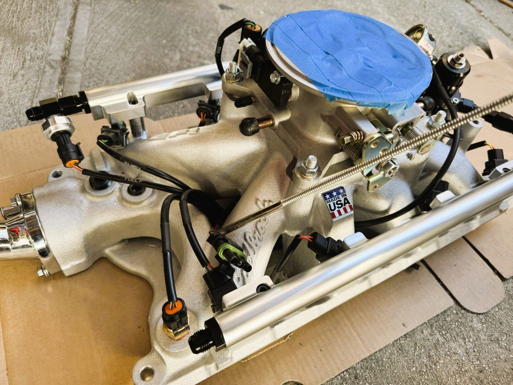 Edelbrock Pro Flo EFI system mocked up on cardboard