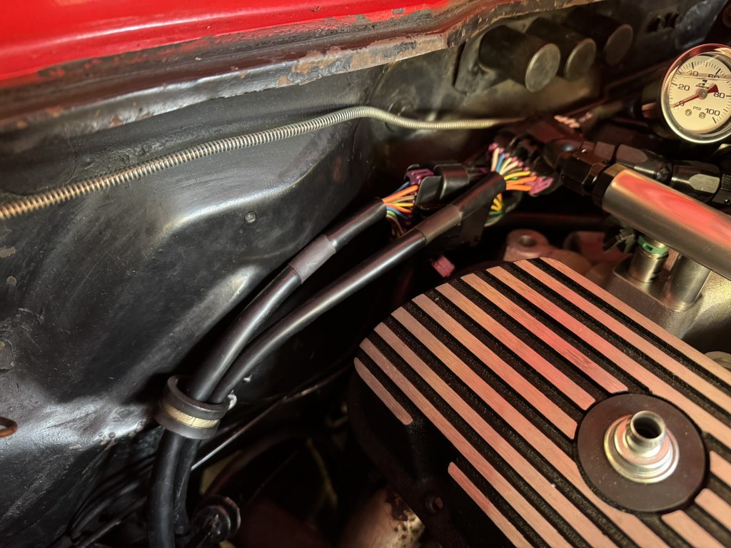 wire harness mounted on firewall in engine bay