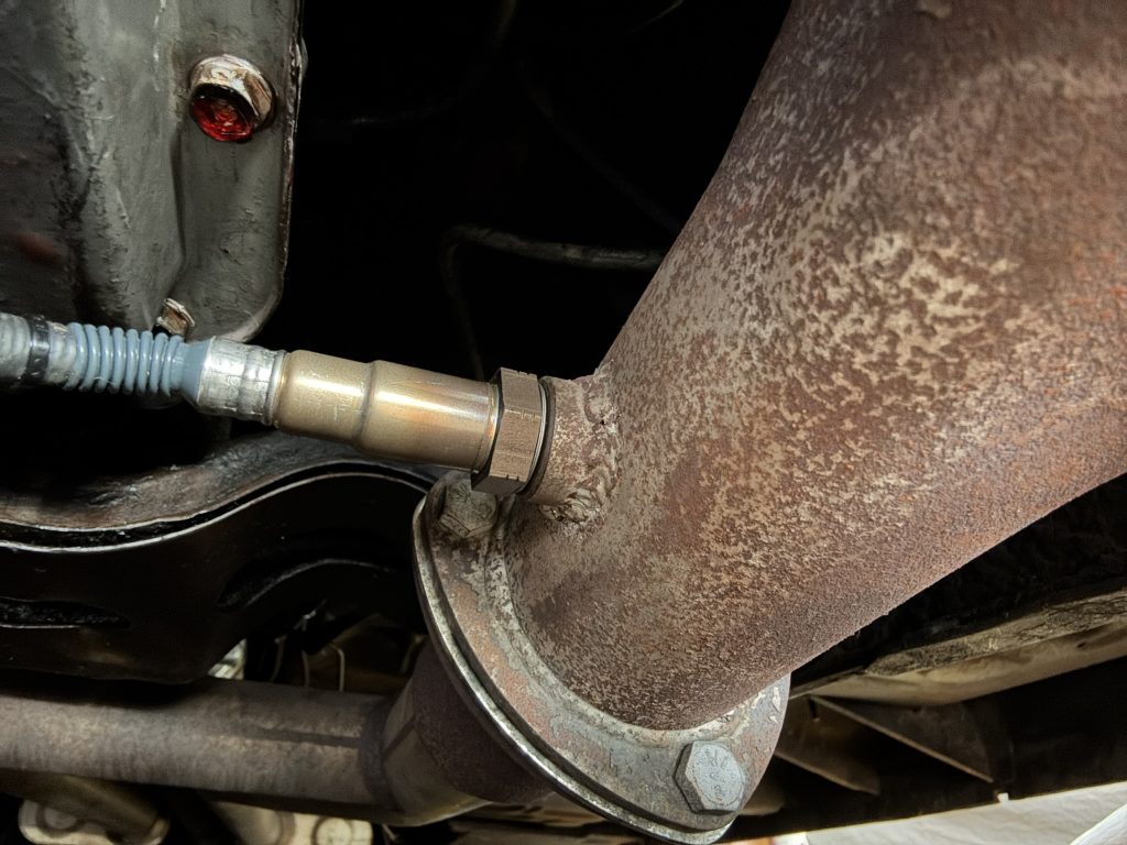 O2 sensor installed in a section of exhaust tubing