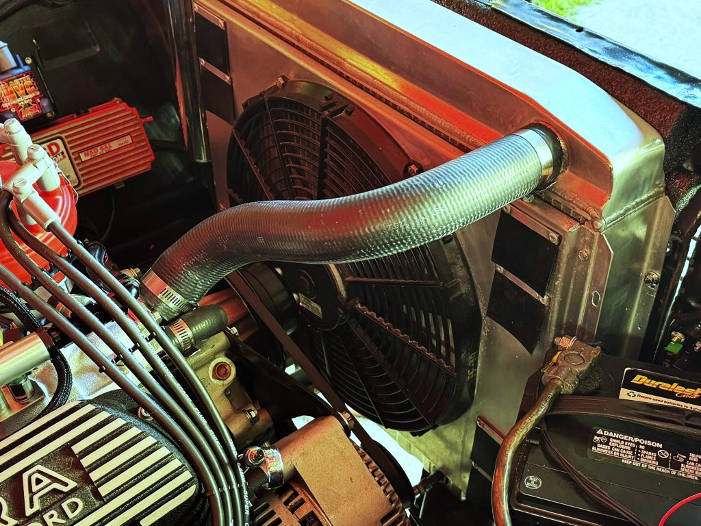 radiator and fan installed in an engine bay