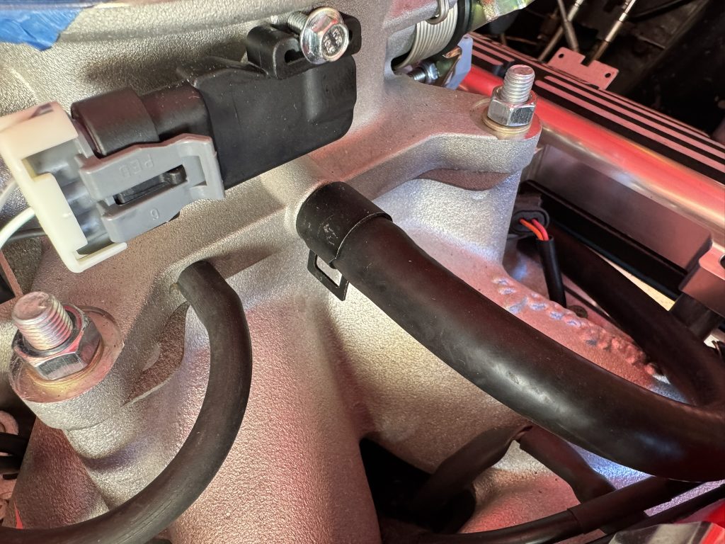 vacuum hose installed on an efi throttle body