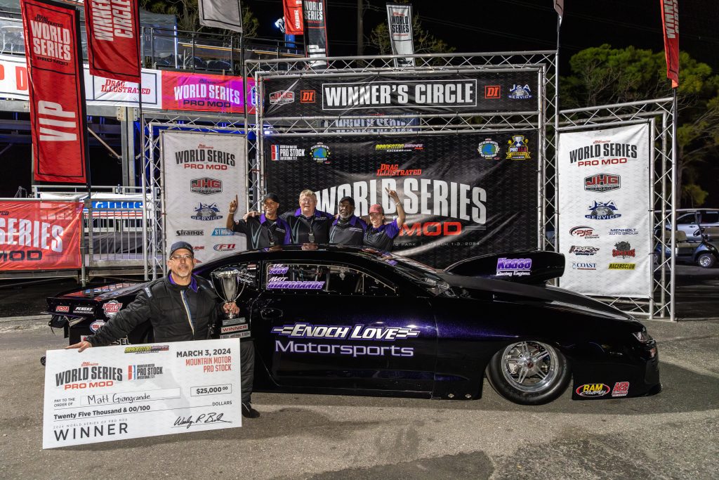 drag race team in winners circle