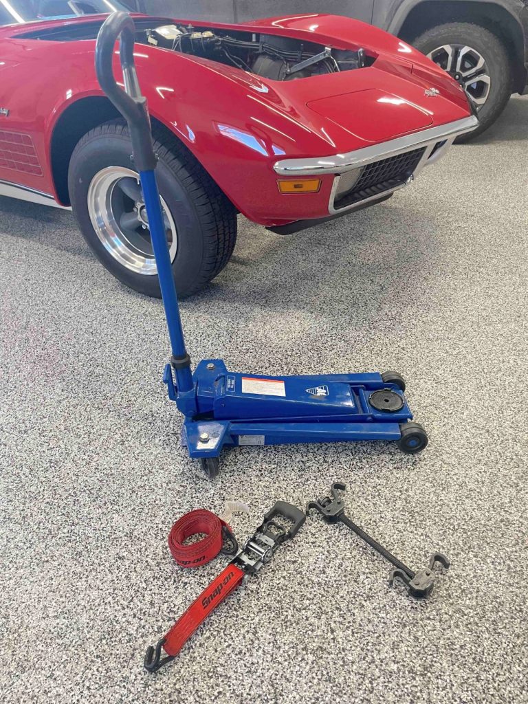 Floor jack, coil spring compressor, ratchet strap